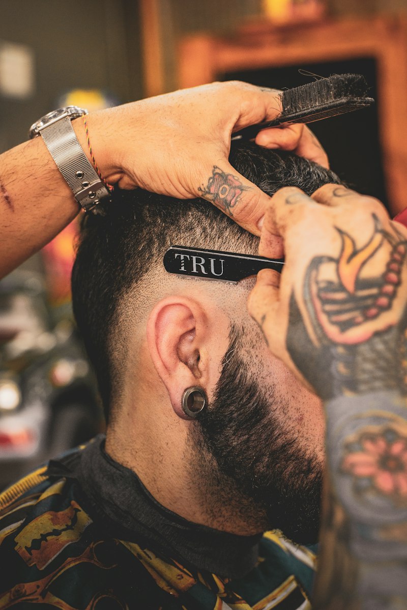 Barber using a straight razor